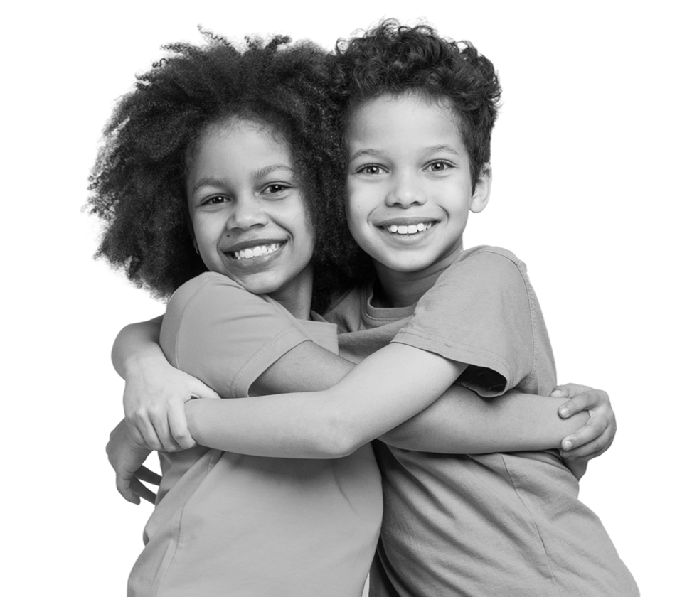 Two children hugging and laughing